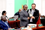 DPM Cooper presented Floating Trophy in the House of Assembly for his win of the recent 'National Family Island Regatta Parliamentary Cup Challenge'